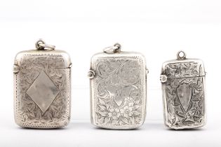 Three Victorian and later silver foliate engraved vesta or match cases.