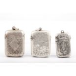 Three Victorian and later silver foliate engraved vesta or match cases.