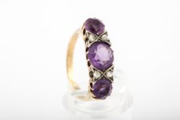 A vintage amethyst and diamond dress ring.