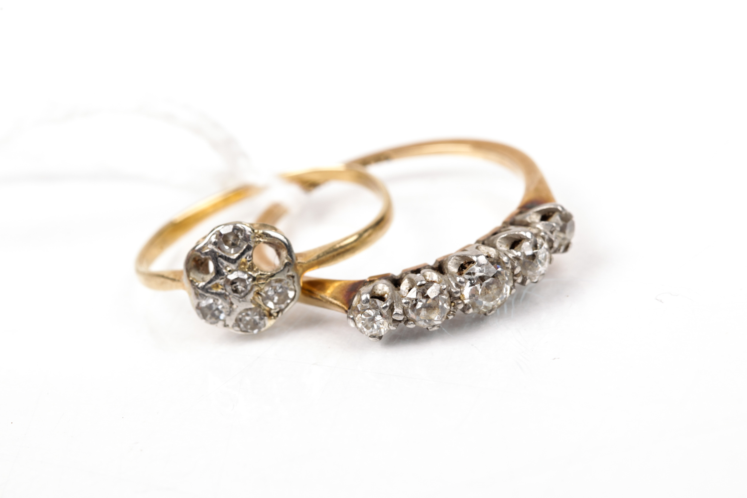 Two early 20th century gold and diamond rings.
