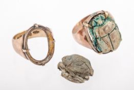 Two early 20th century rose gold and steatite scarab rings.