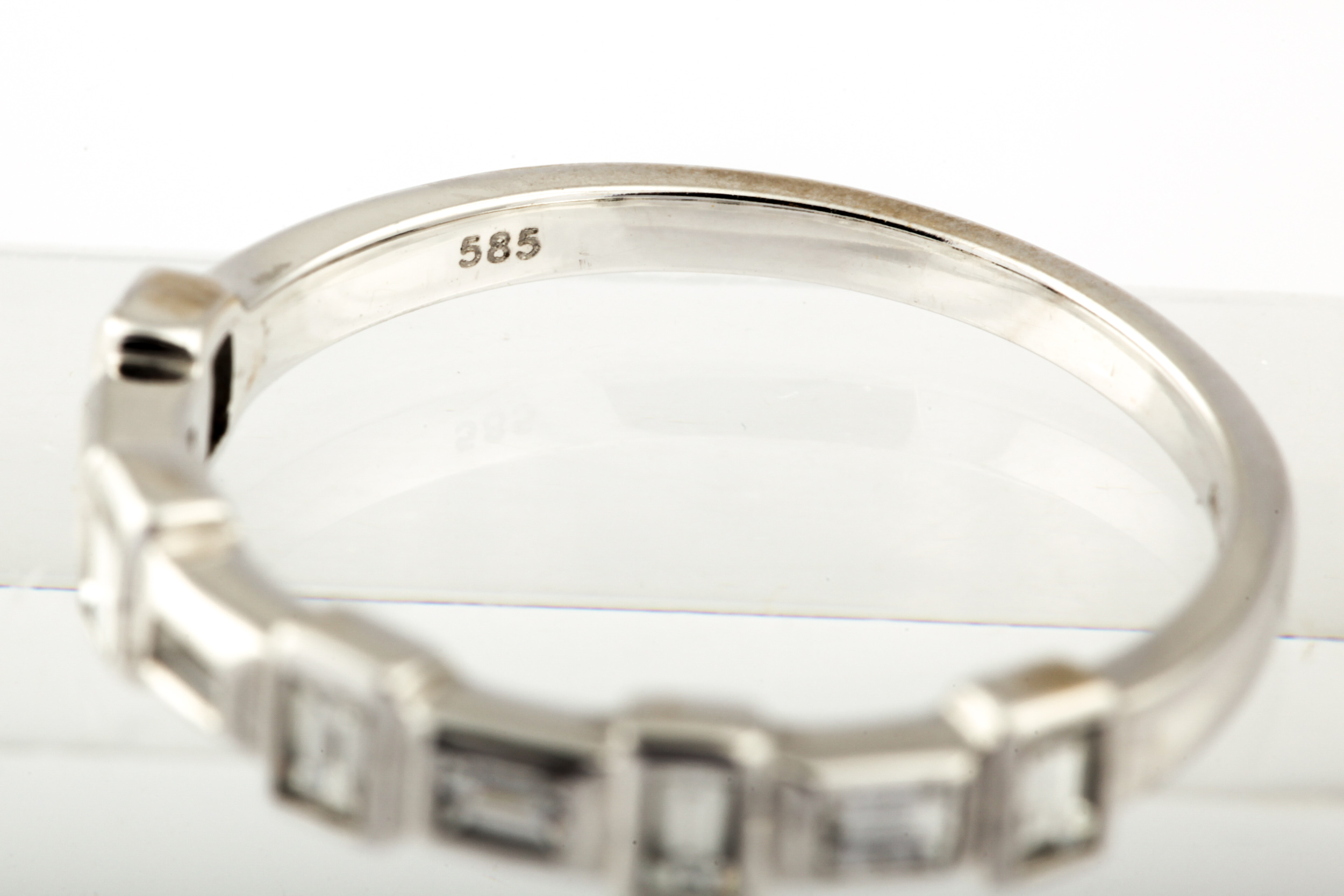 A modern 14ct white gold and diamond half-hoop ring. - Image 5 of 5