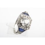 A mid-20th century platinum, diamond and sapphire cluster ring in the Art Deco manner.