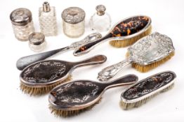 A collection of silver mounted dressing table items.