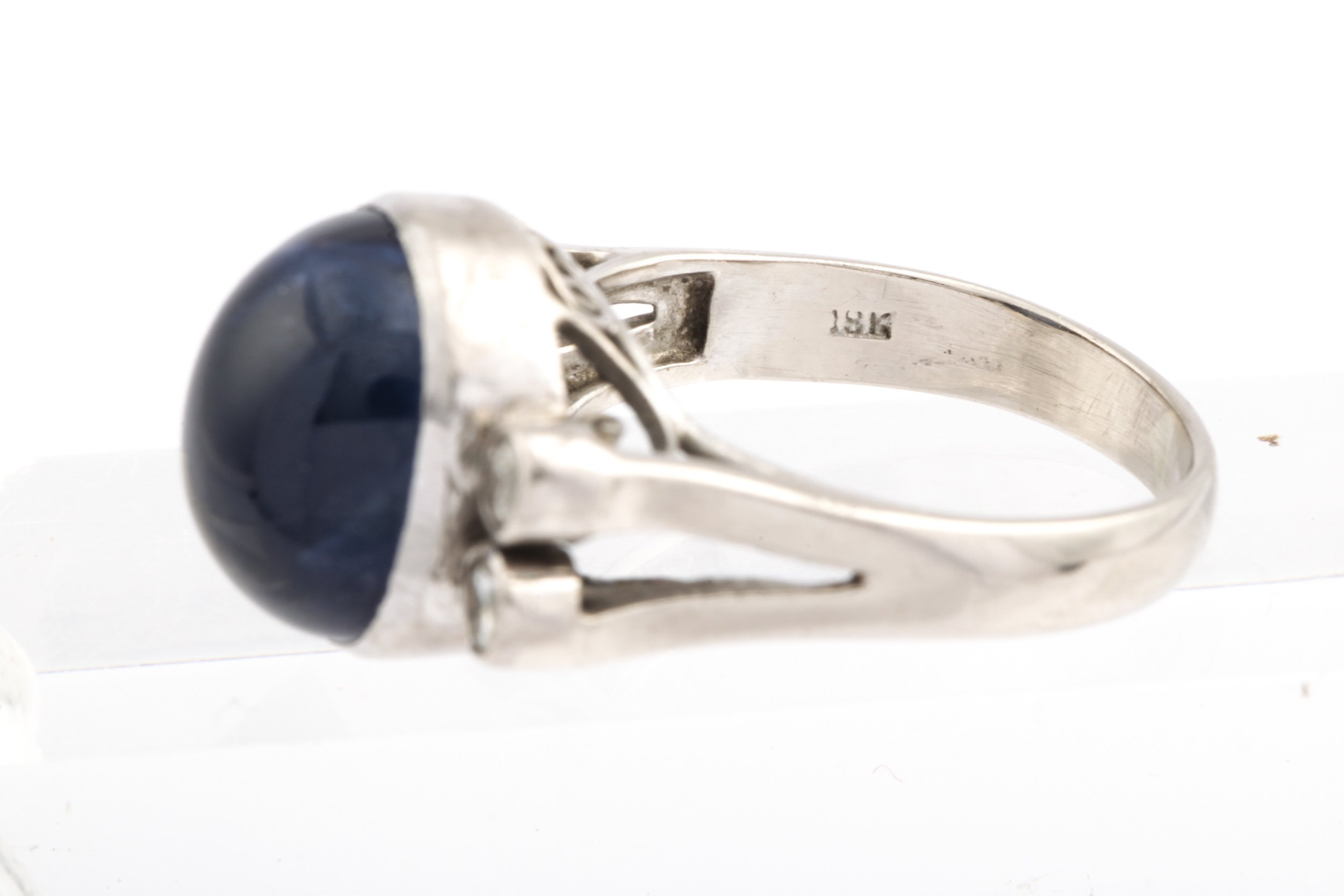 A mid-20th century cabochon sapphire and diamond dress ring. - Image 4 of 4