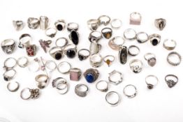 A large collection of silver and white metal rings.