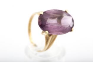 A vintage Continental gold and amethyst single stone ring.