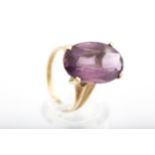 A vintage Continental gold and amethyst single stone ring.