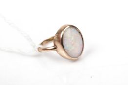 A vintage gold and opal single stone ring.