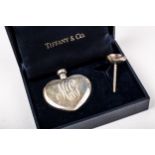 A Tiffany & Co small heart-shaped scent bottle and funnel. Each signed and marked 'Tiffany & Co.
