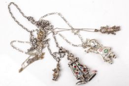 A small collection of silver and white metal articulated harlequin clown pendants.