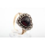 A Victorian garnet and rose diamond heart-shaped cluster adapted as a ring.