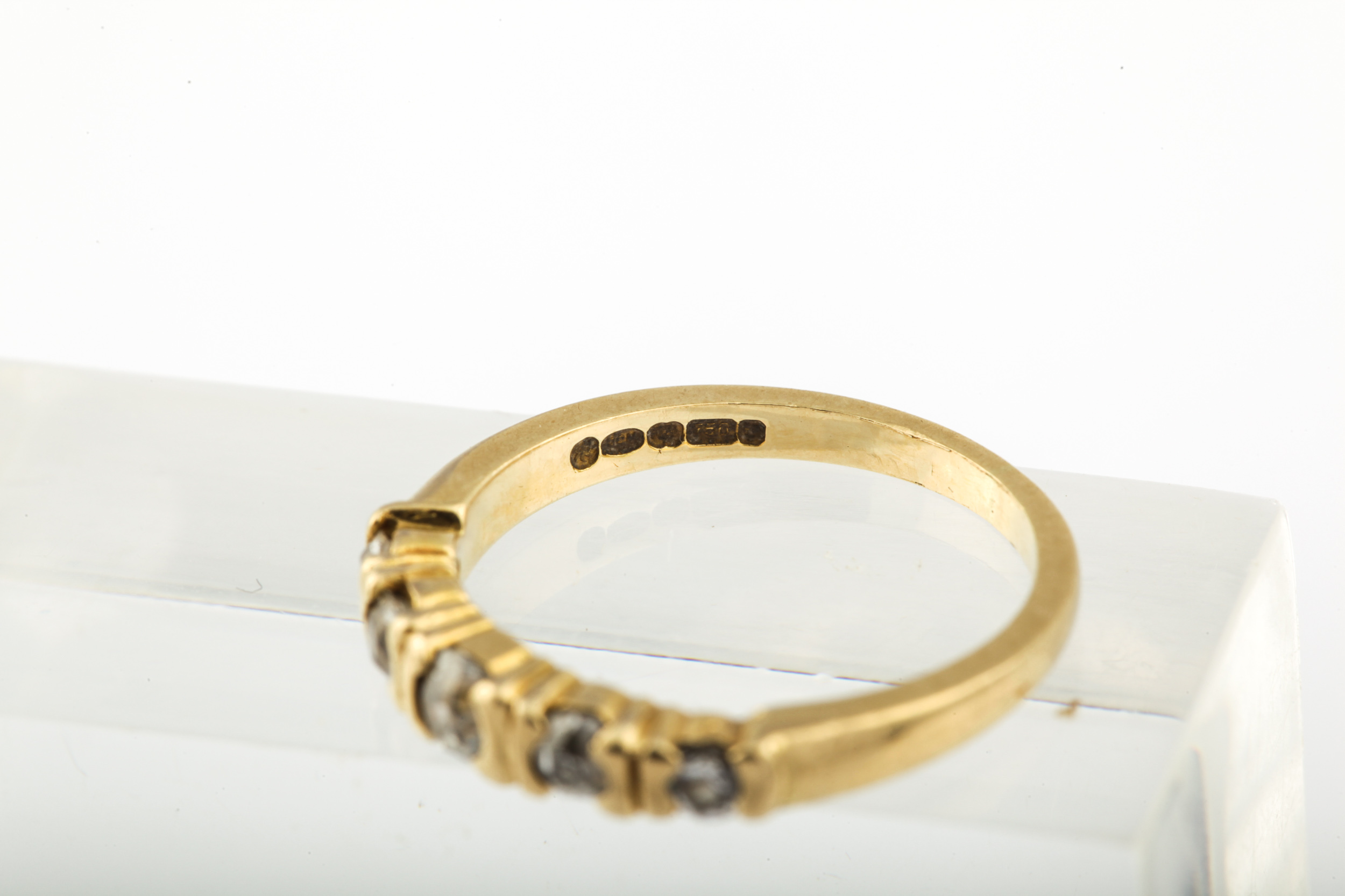 A modern 18ct gold and diamond five stone ring. The graduated old-cut stones approx. 0. - Image 9 of 10