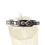 A vintage white gold and diamond half-eternity ring. The 11 round brilliants approx. 0.
