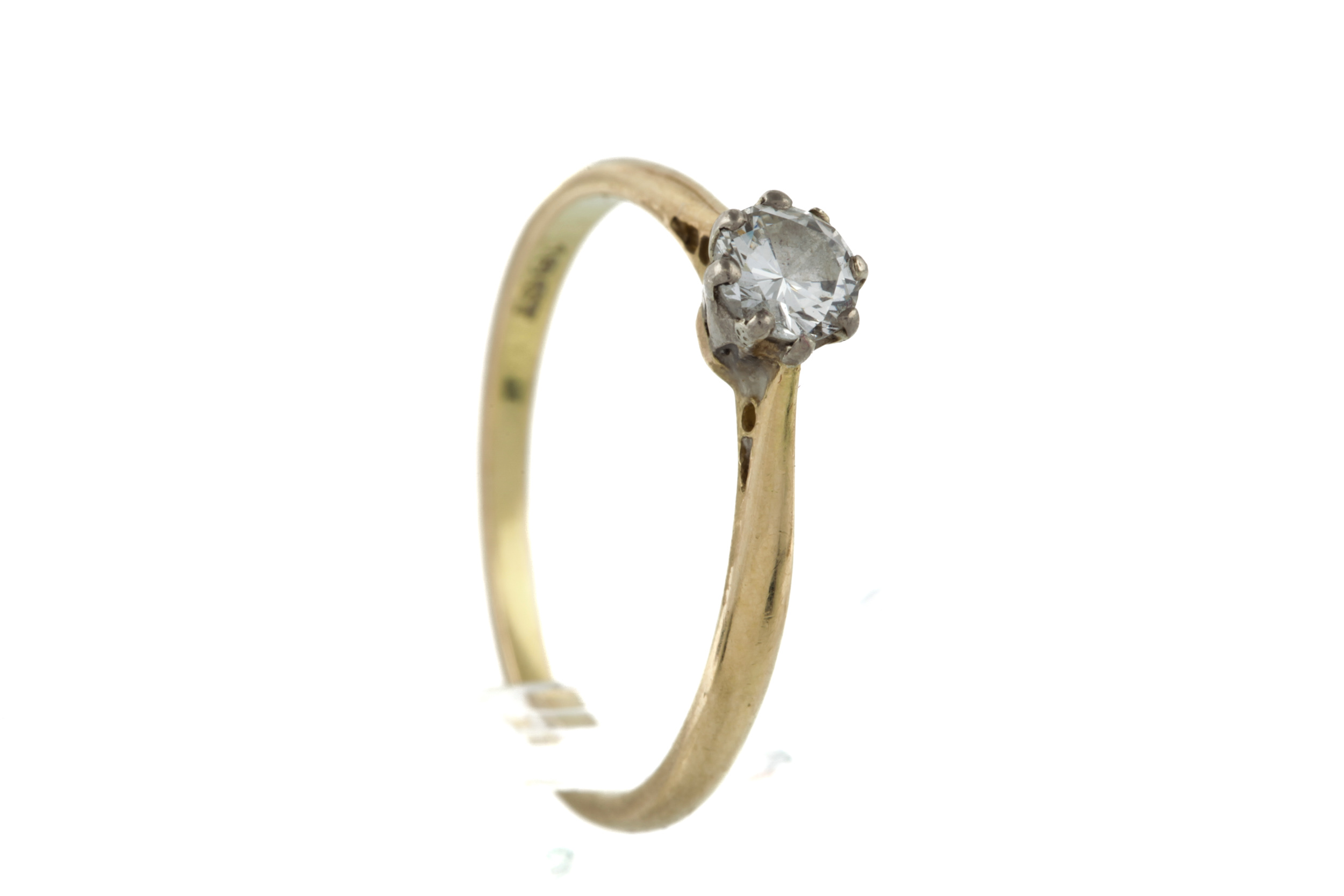 A mid-20th century gold and diamond solitaire ring. The round brilliant approx. 0.