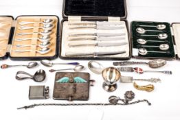 A collection of silver tea and coffee spoons and other items, some in cases.