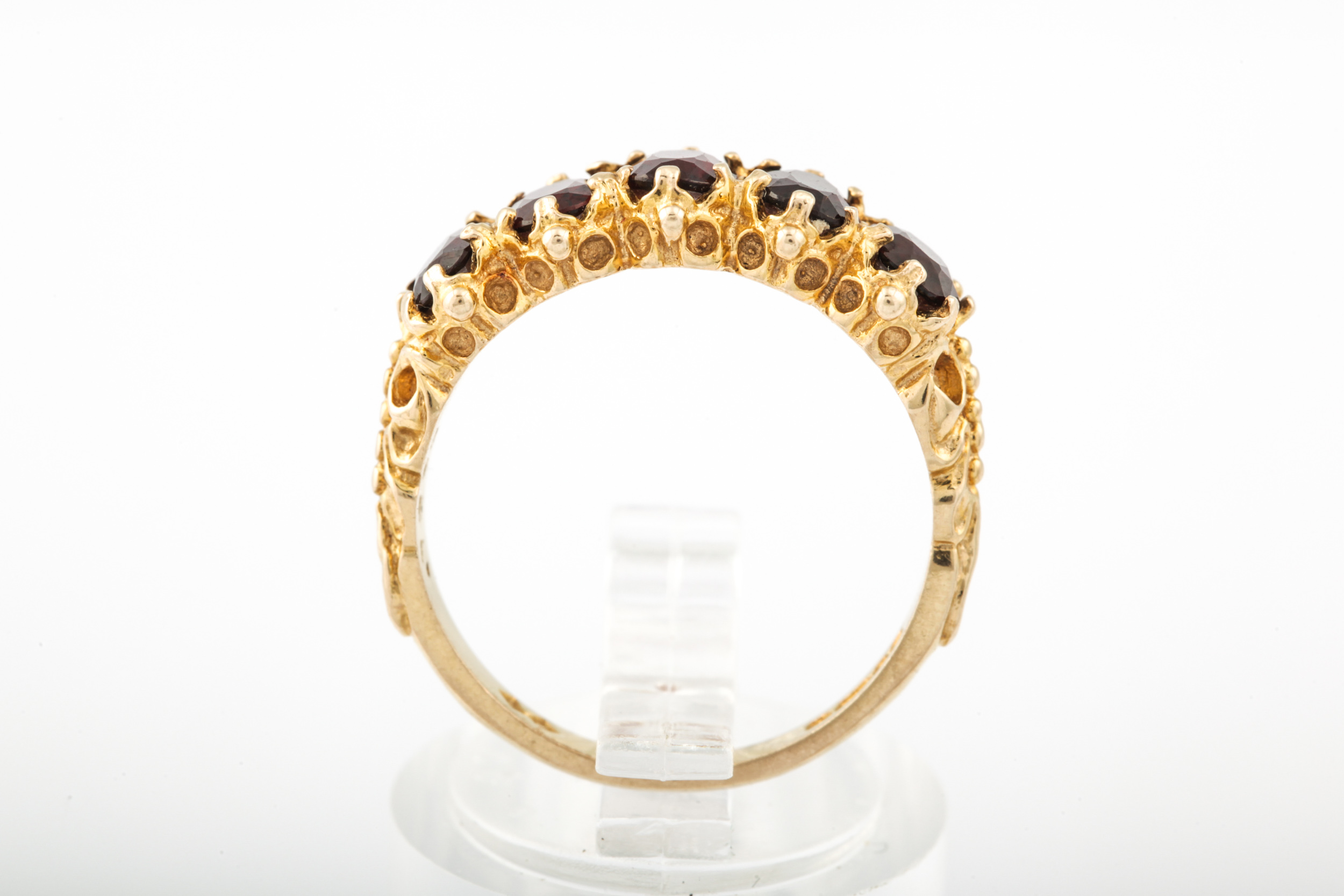 A vintage 9ct gold and garnet five stone ring. - Image 2 of 6