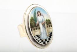 A Continental polychrome enamelled oval panel ring depicting an angel.