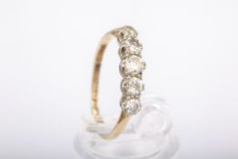 A mid-20th century gold and diamond five stone ring. The graduated old-cut stones approx. 0.