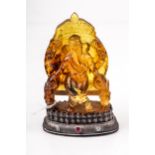 An Indian carved amber-type statue of Ganesha.