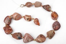An Australian boulder opal tumble-polished abstract bead necklace.