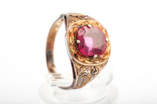 An early 20th century gold and synthetic-ruby single stone ring.