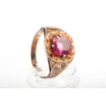 An early 20th century gold and synthetic-ruby single stone ring.