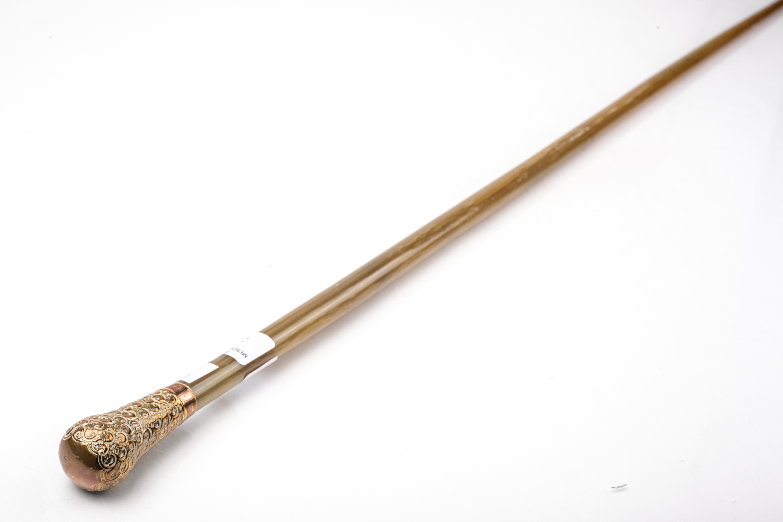 An early 20th century horn cane with a gold-plated embossed terminal marked '18ct GF'.