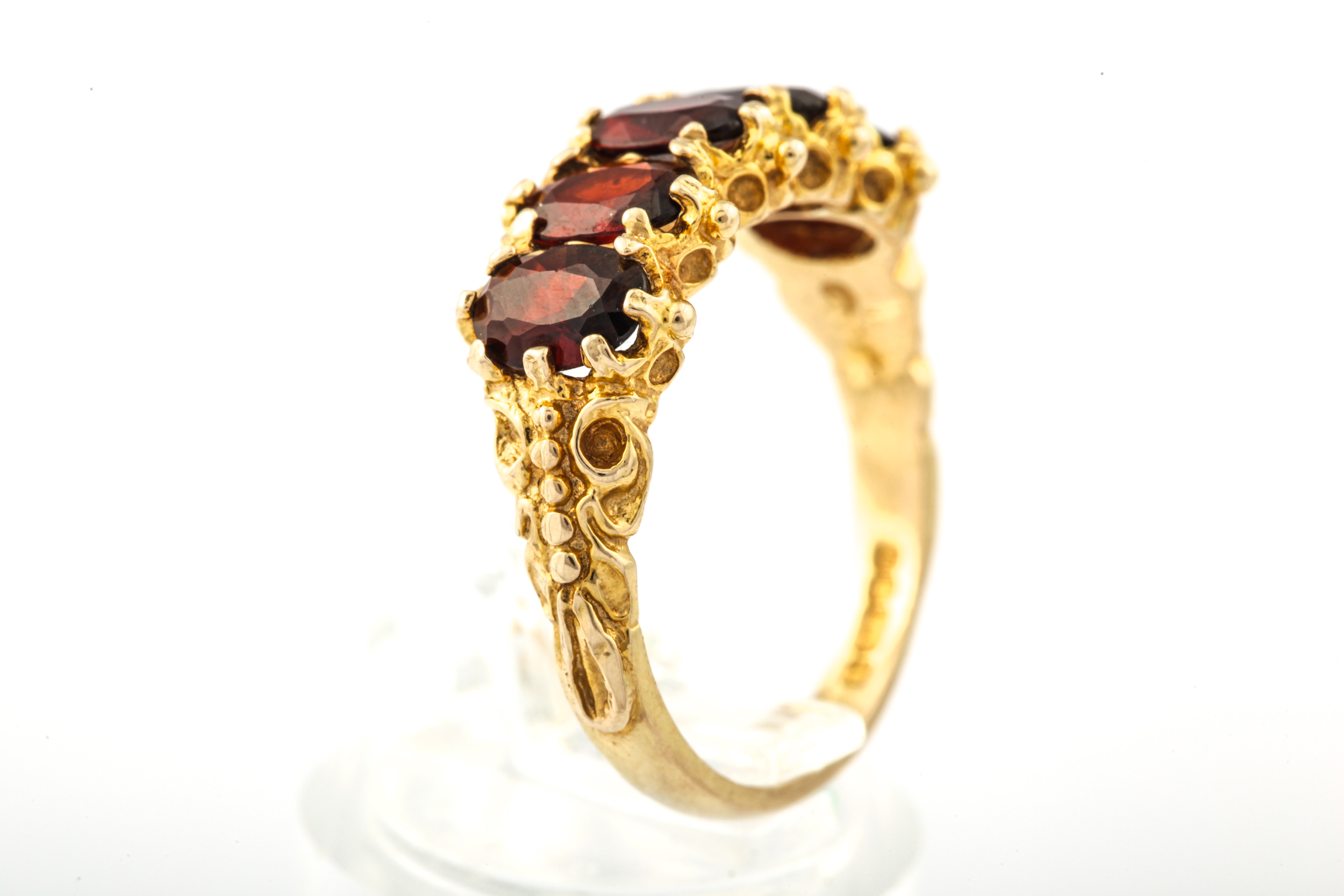 A vintage 9ct gold and garnet five stone ring. - Image 3 of 6