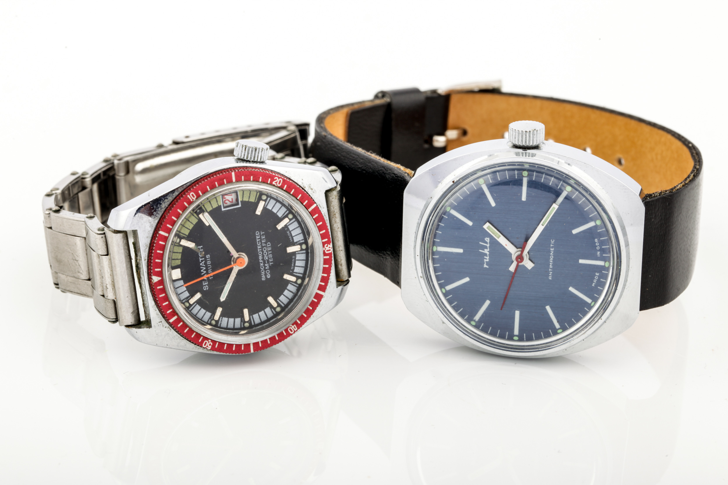 Two vintage gentleman's stainless steel wristwatches in 1970s style.