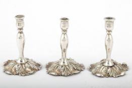 A set of three late Victorian silver miniature candlesticks.