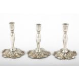 A set of three late Victorian silver miniature candlesticks.