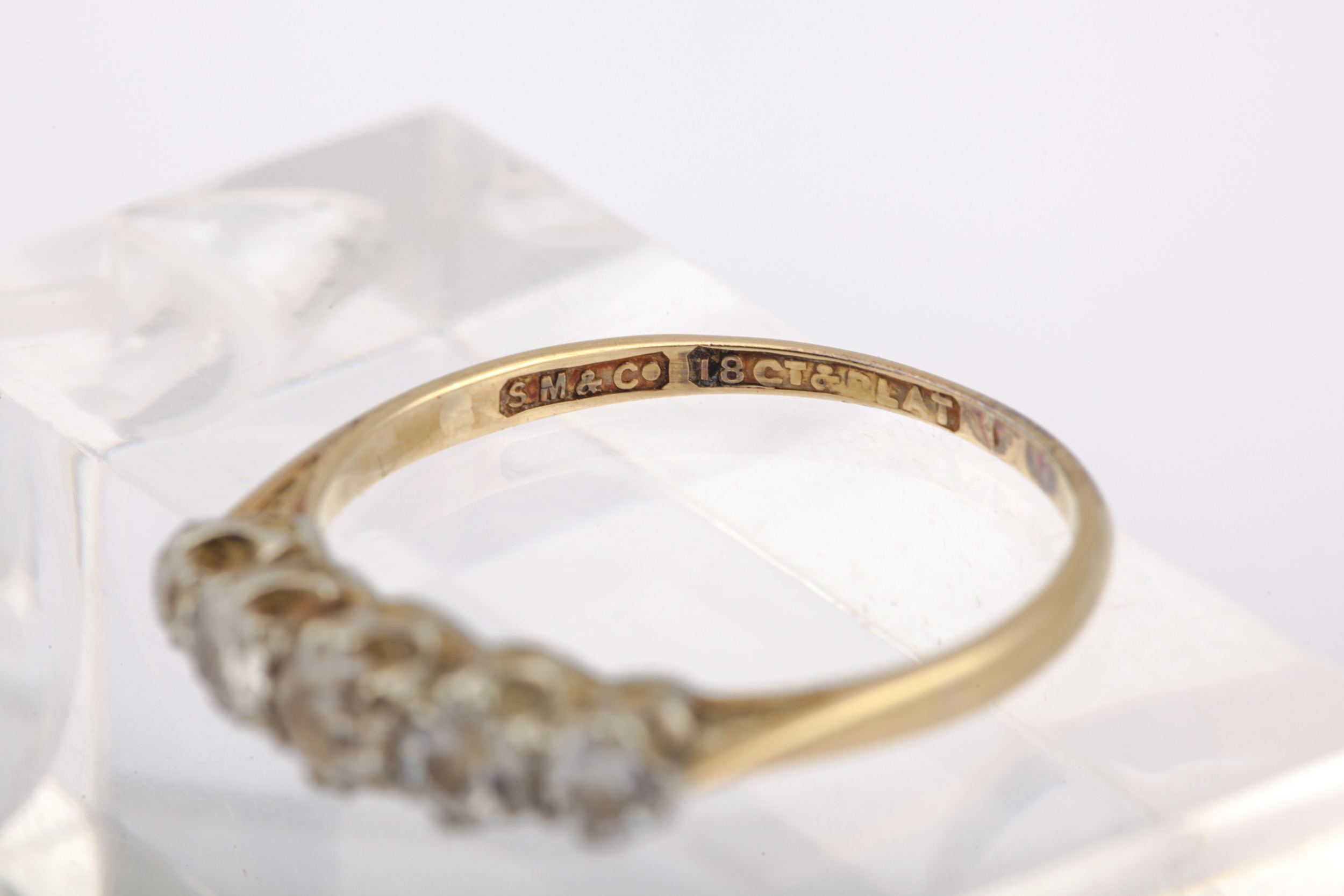 A mid-20th century gold and diamond five stone ring. The graduated old-cut stones approx. 0. - Image 4 of 5