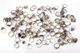 A large collection of silver and white metal rings.