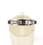 A vintage white gold and diamond five stone ring. The round brilliants approx. 0.