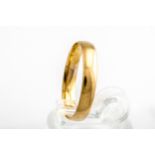 An early 20th century 22ct gold D-section wedding band. Hallmarks for Birmingham 1913, 3.