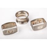 Three silver napkin rings.