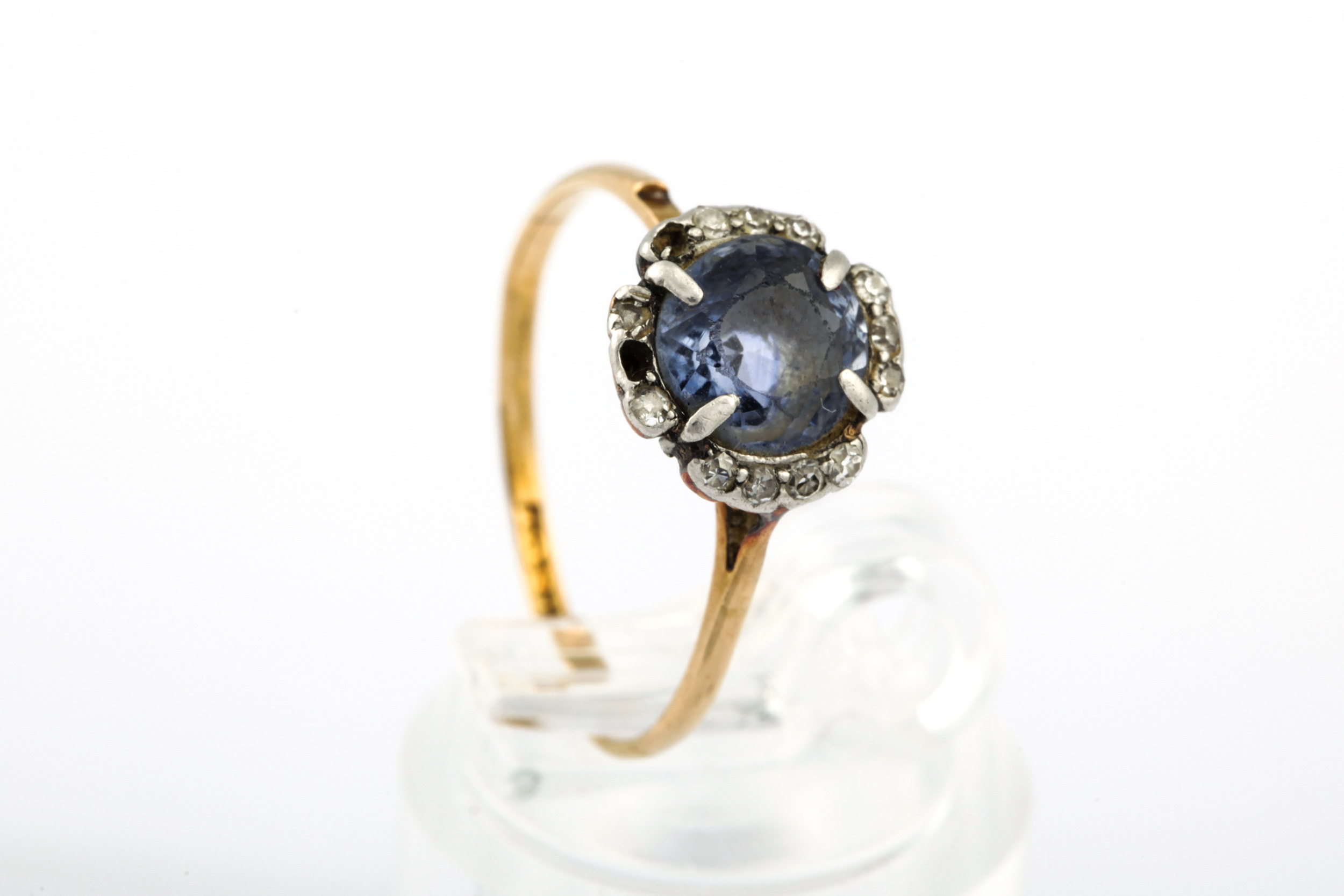 An early 20th gold, sapphire and diamond cluster ring.