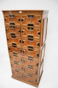 A reproduction mahogany and burr walnut chest of drawers.