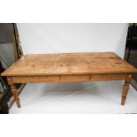 A large vintage pine dining table.