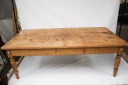 A large vintage pine dining table.