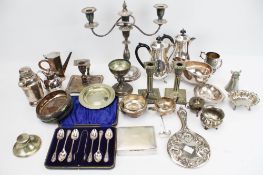 A group of various silver plated items. Including a candlesticks, jugs and flatware, etc. Max.