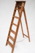 A vintage wooden step ladder. With six rungs.