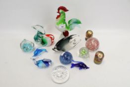 A collection of assorted glass paperweights and ornaments. Including fish and a cockerel, etc. Max.