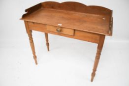A vintage pine washstand. With single central drawer on turned tapering supports, L99cm x D44.