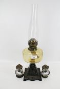 A pair of vintage cycle lamps and oil lamp.