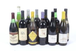 Twelve assorted bottles of wine.
