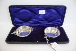 A boxed set of two Hallmarked silver wine tasters 107 grams