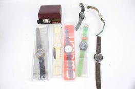 Seven assorted Swatch Quartz wristwatches and a Timex.