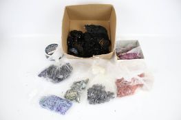 A box of coral and jet beads and costume jewellery